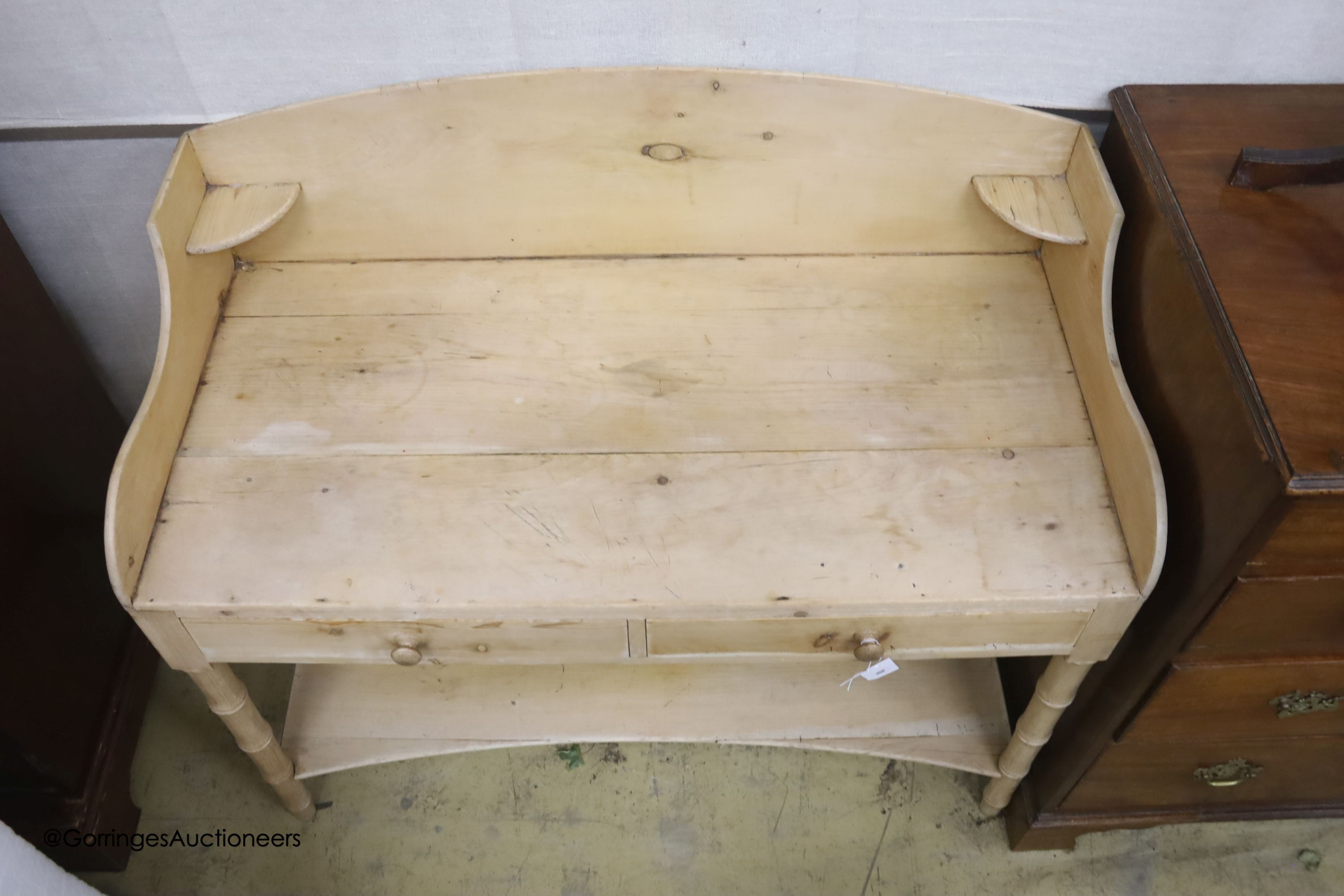 An early 19th century pine two tier washstand, width 105cm, depth 50cm, height 93cm